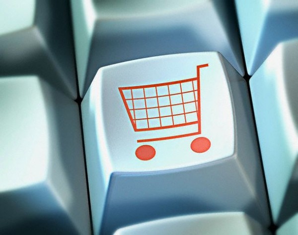 Shopping trolley on button of computer keyboard onlineshopping