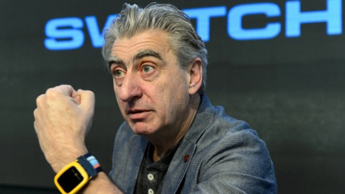 CEO of Swatch Group Nick Hayek poses with a watch 